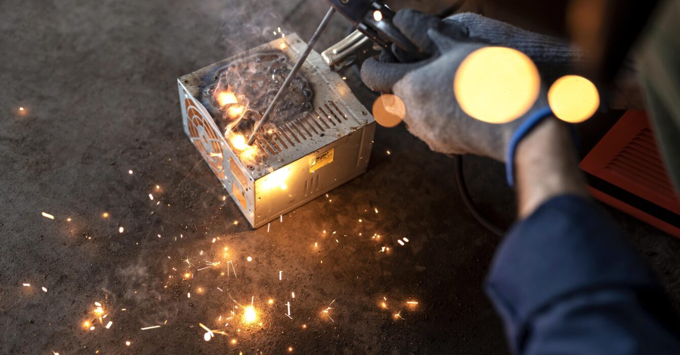 male-mechanic-working-his-workshop male-mechanic-working-his-workshop