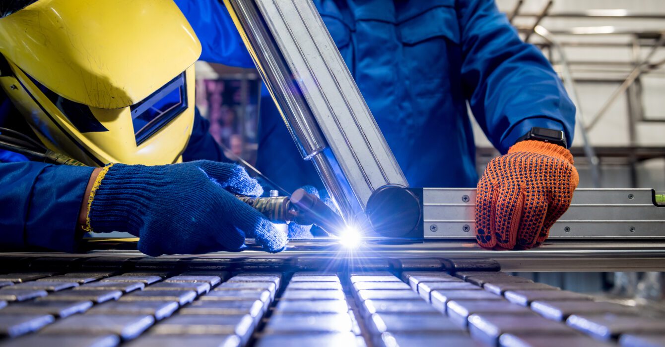 Welder working in a steel factory with argon welding Welder working in a steel factory with argon welding